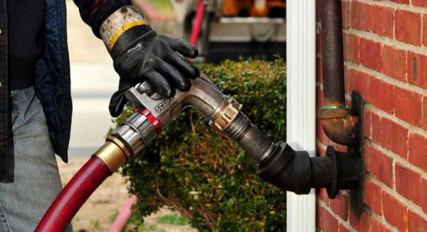 All Island Comfort technician delivering home heating oil on Long Island